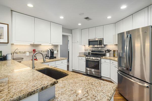 modern kitchen design trends in Brandon FL featuring white cabinets quartz countertops and open layout